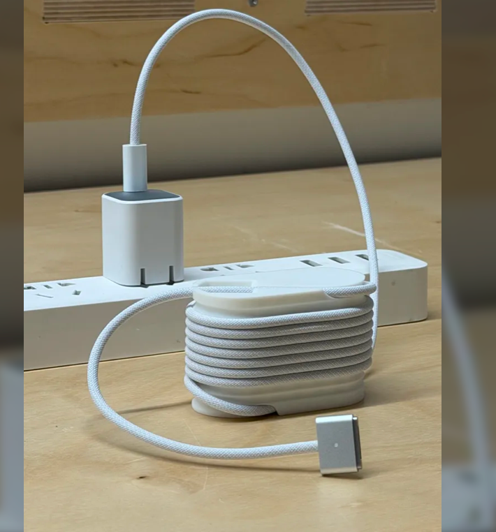 3D-printed cable management winder with coiled cable