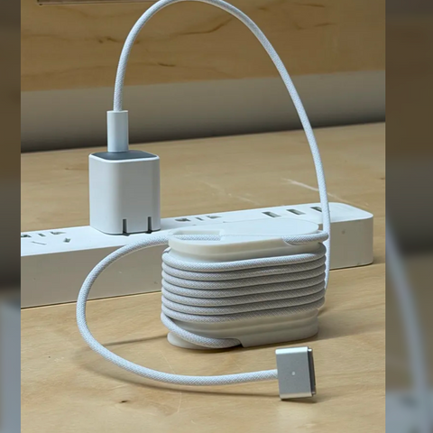 3D-printed cable management winder with coiled cable
