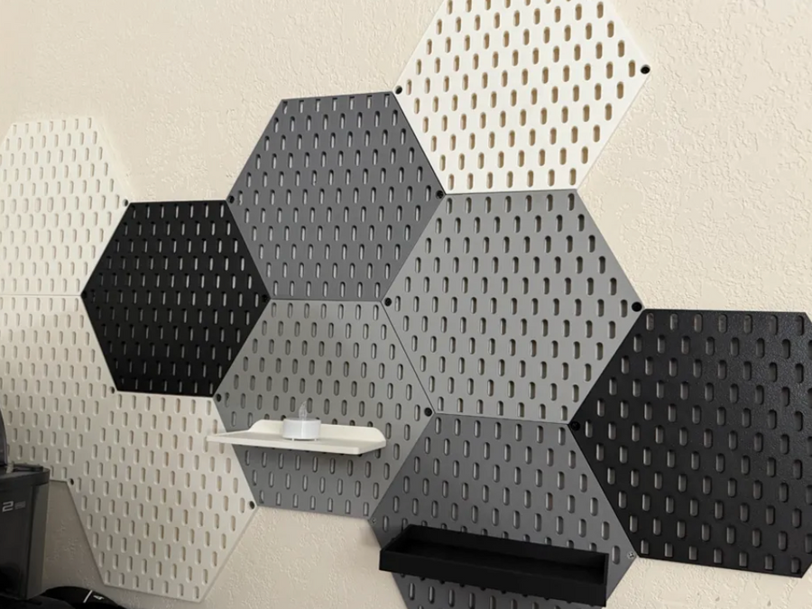 3D-printed hexagonal pegboard tiles in multiple colors