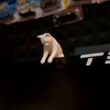 3D-printed cat peeking over the top of a monitor